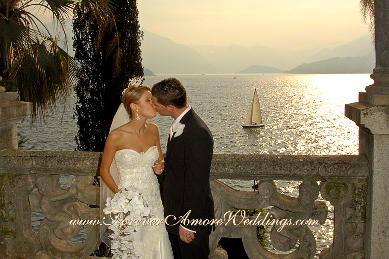 romantic bridal couple kissing at varenna lake como